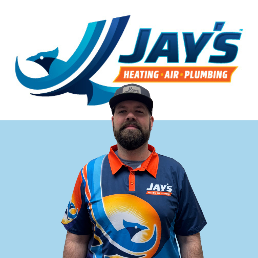A person in a colorful shirt and cap stands proudly in front of a logo for "Jay's Heating-Air-Plumbing," embodying the quality service and expertise of our 5-star technicians.